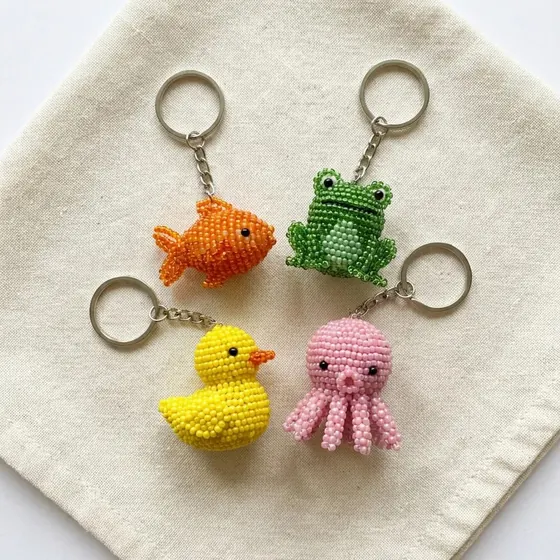 Beaded fish, frog, duck and octopus keychains